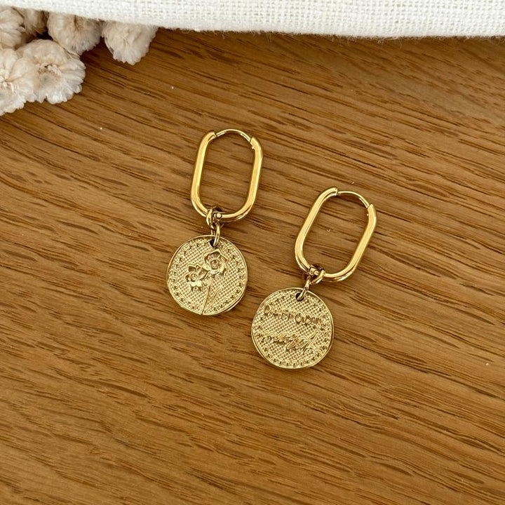 Boucles d'oreilles fleur de naissance acier