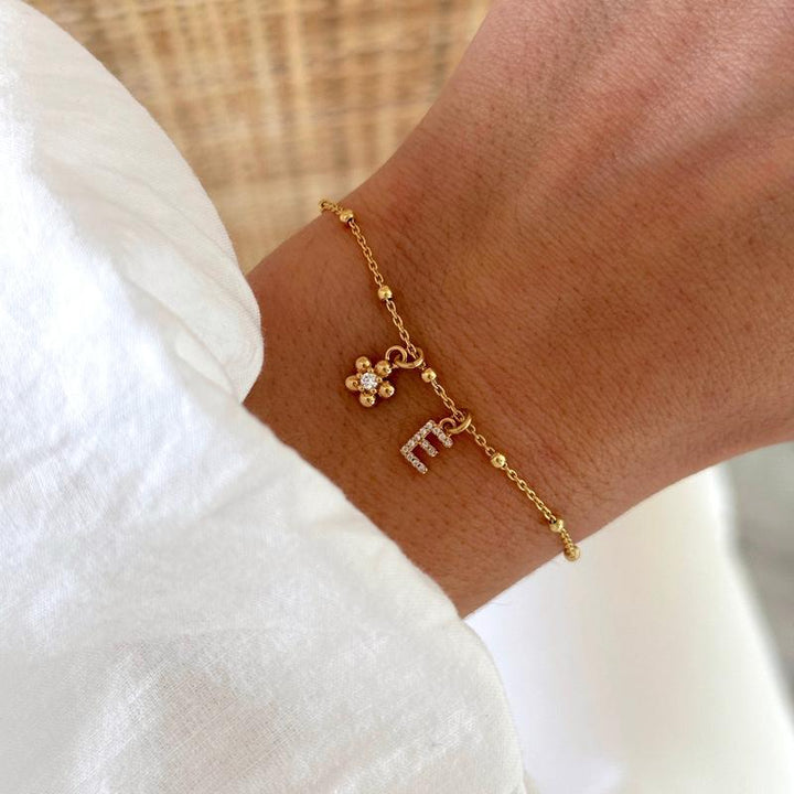 Pulsera «Luce» con flor chapada en oro - Pulseras - Momentos de placer - 1 letra + 1 flor -Instants Plaisirs | Joyería