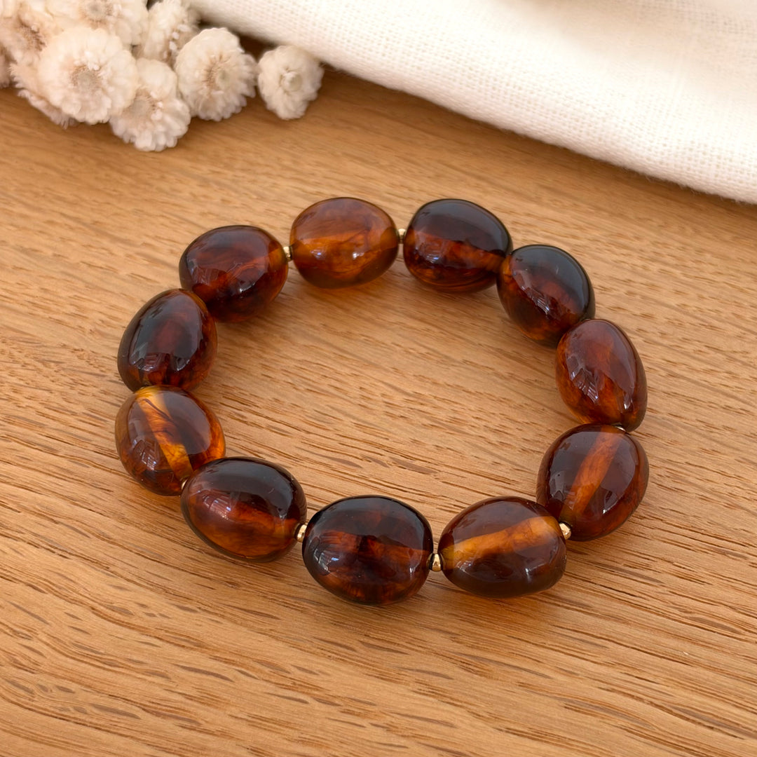 Bracelet élastique en perle de résine couleur ambre marron 