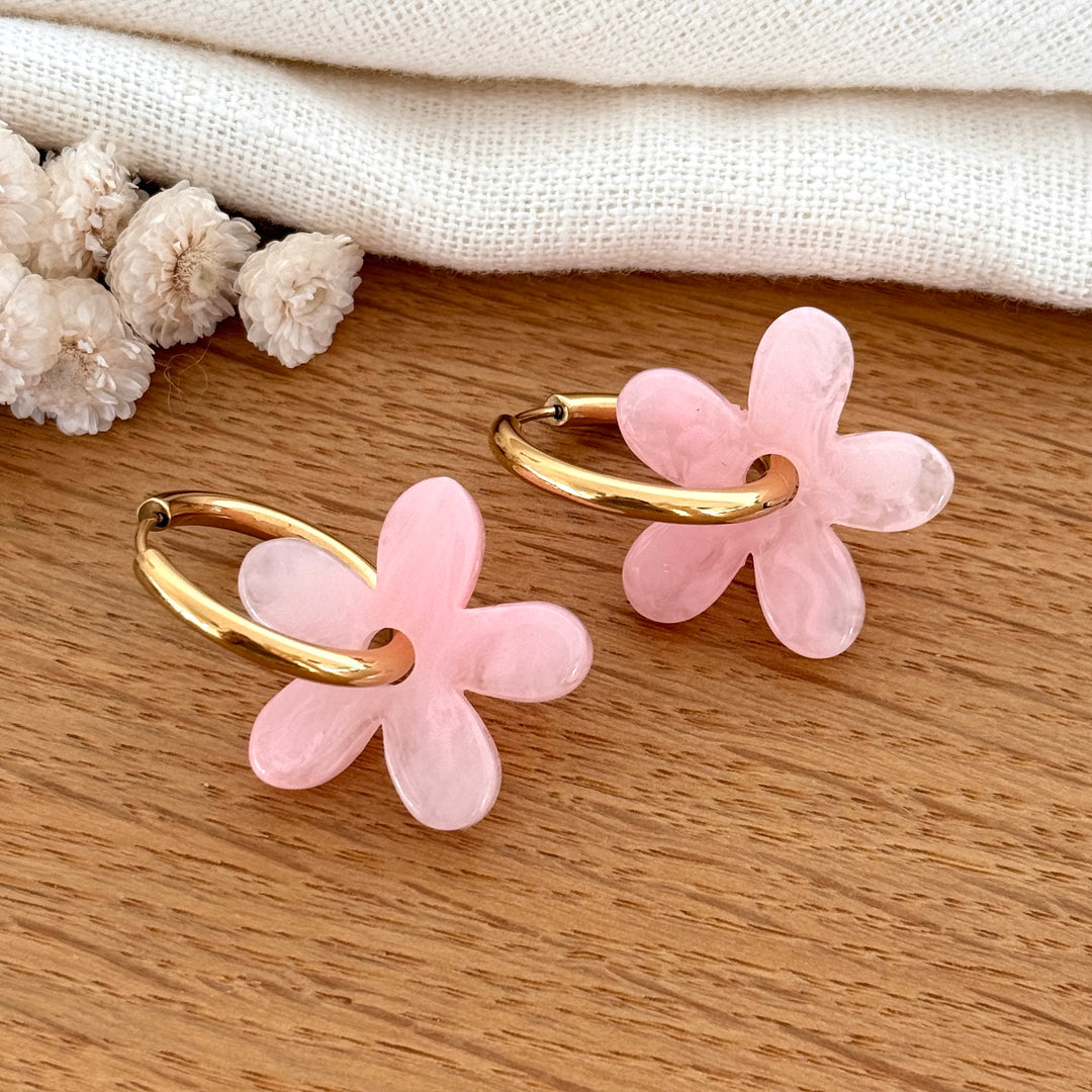 Hoop earrings adorned with pink acetate flowers