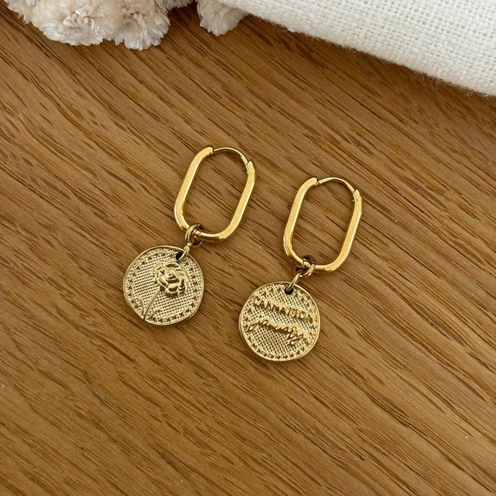 Boucles d'oreilles fleur de naissance acier