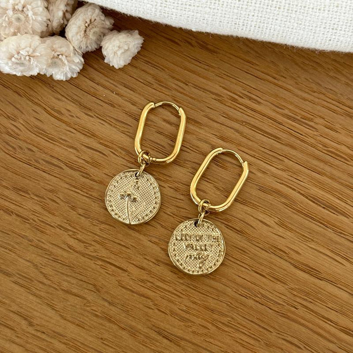 Boucles d'oreilles fleur de naissance acier